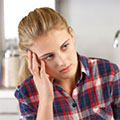 Preteen girl talks to doctor in hospital